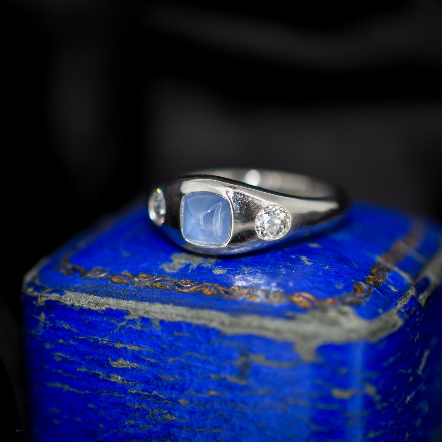 Sugarloaf Star Sapphire and Diamond Three Stone Platinum Band Ring