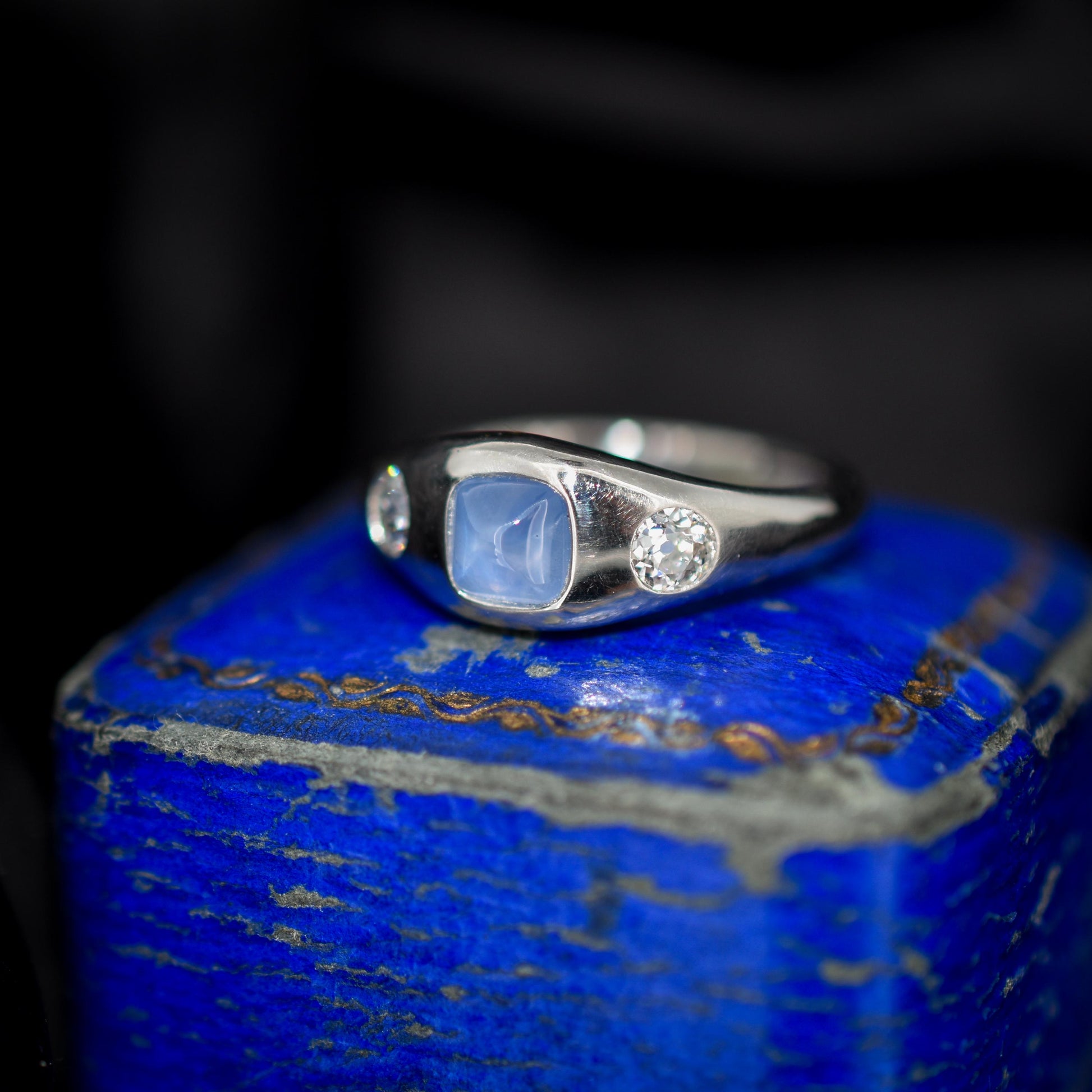 Sugarloaf Star Sapphire and Diamond Three Stone Platinum Band Ring