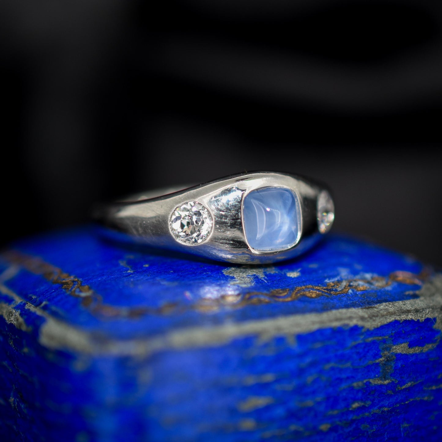 Sugarloaf Star Sapphire and Diamond Three Stone Platinum Band Ring