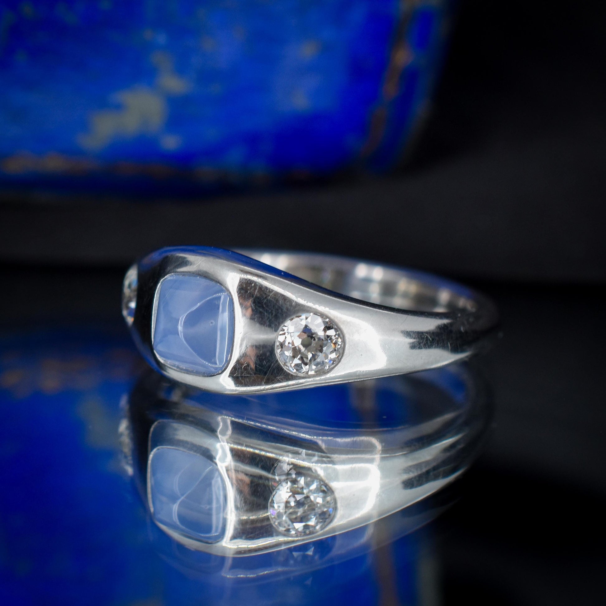 Sugarloaf Star Sapphire and Diamond Three Stone Platinum Band Ring