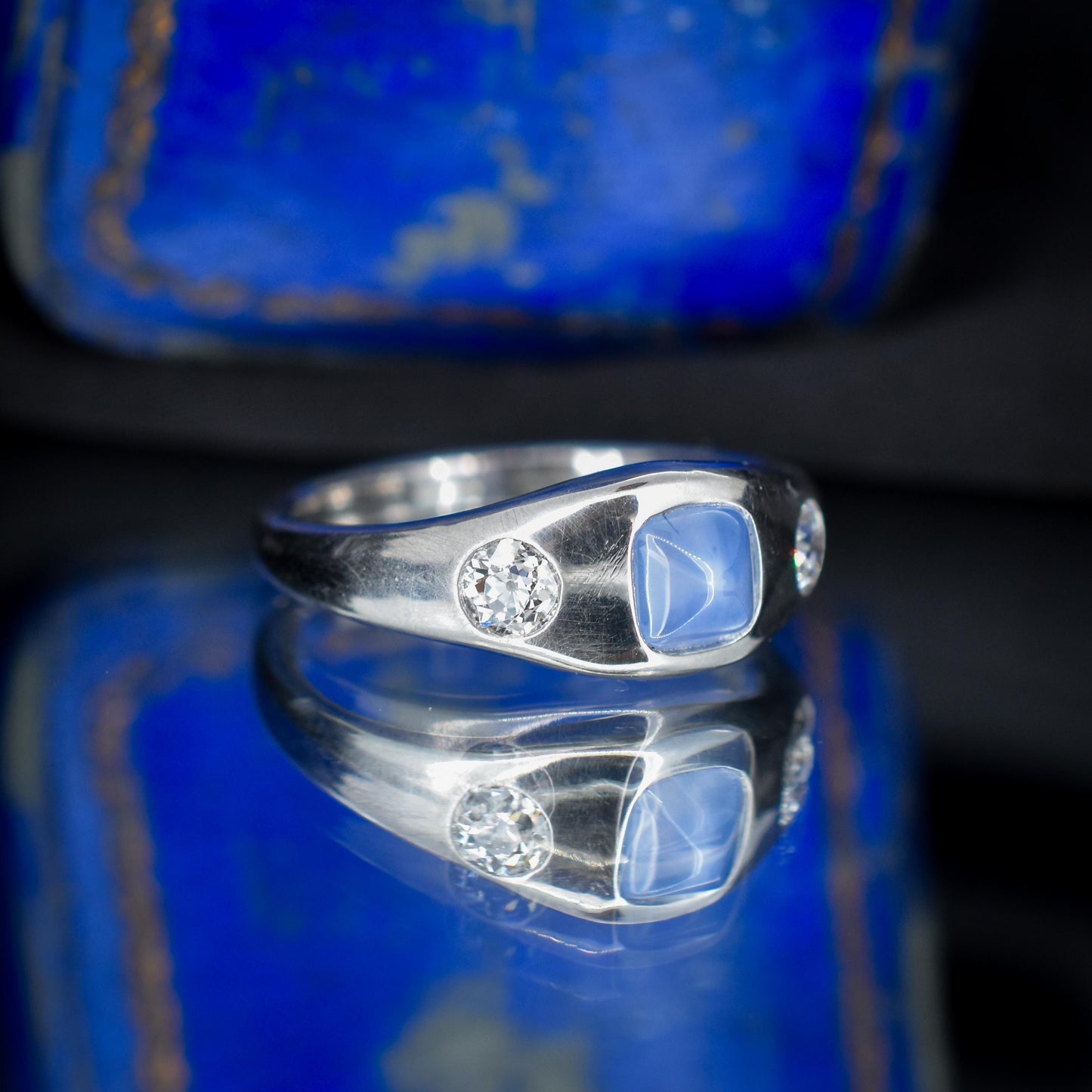 Sugarloaf Star Sapphire and Diamond Three Stone Platinum Band Ring