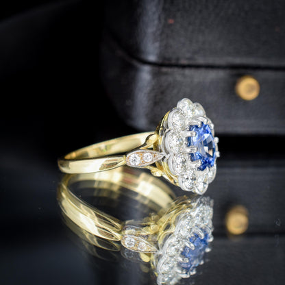 Edwardian Style 0.83ct Blue Sapphire and Diamond Oval Cluster Halo Ring