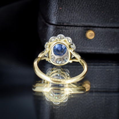 Edwardian Style 0.83ct Blue Sapphire and Diamond Oval Cluster Halo Ring