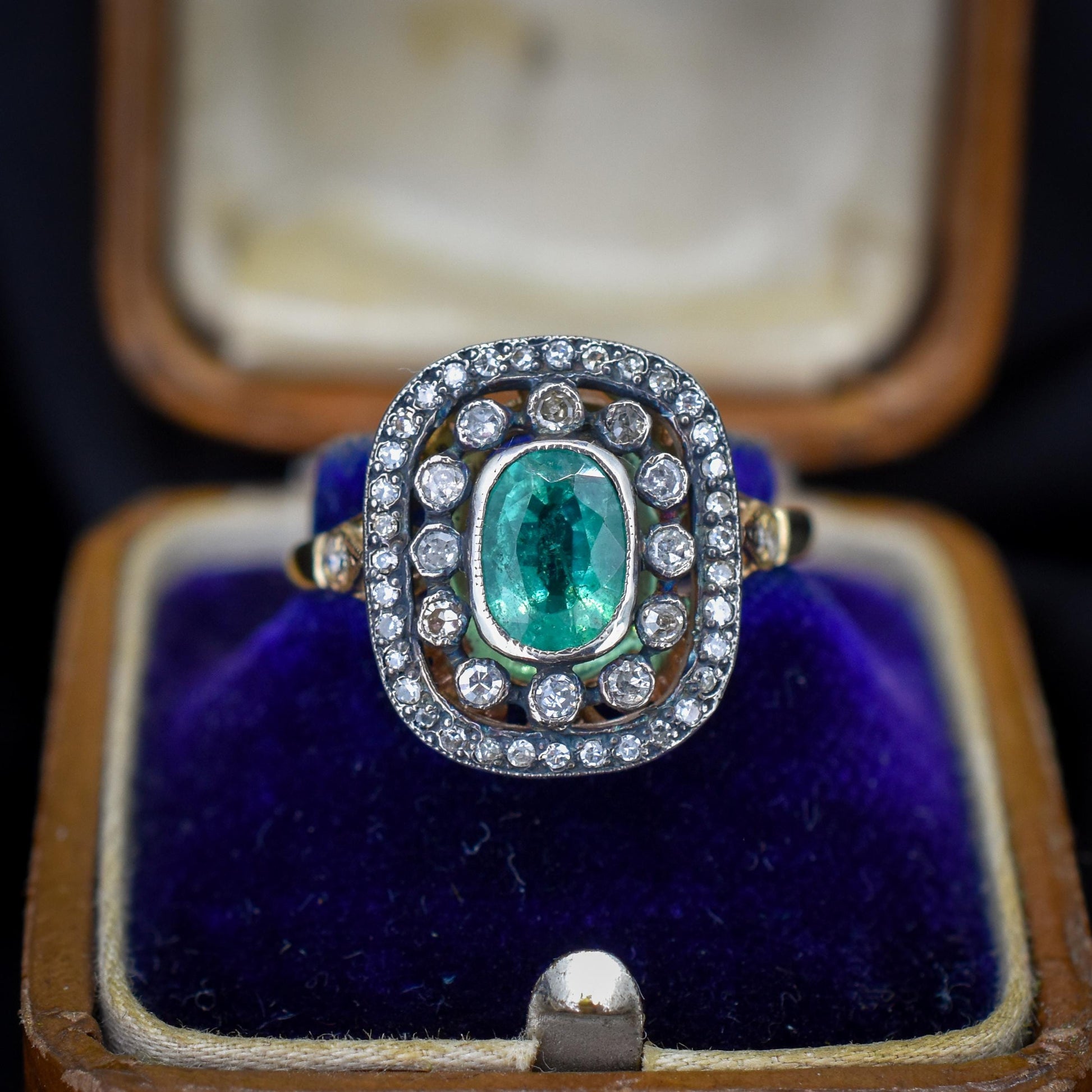 Emerald and Diamond Oval Cluster Halo Yellow Gold and Silver Ring | Antique Style