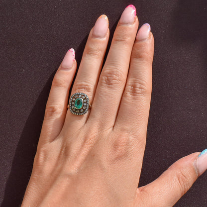 Emerald and Diamond Oval Cluster Halo Yellow Gold and Silver Ring | Antique Style