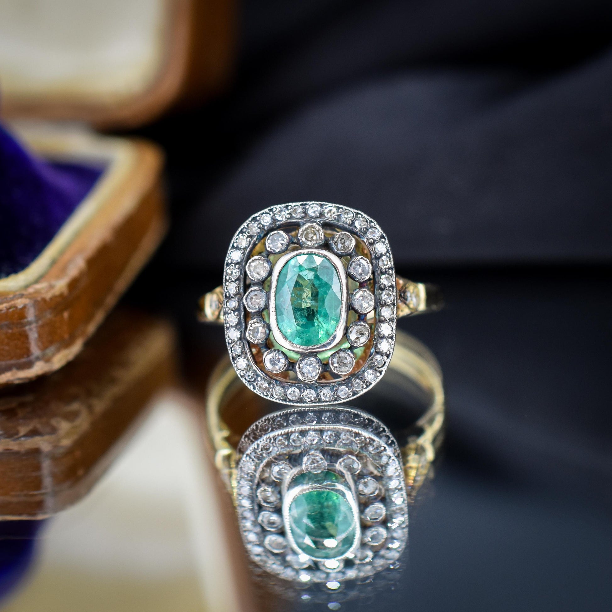 Emerald and Diamond Oval Cluster Halo Yellow Gold and Silver Ring | Antique Style