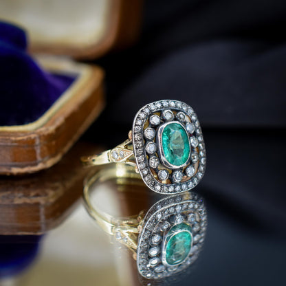 Emerald and Diamond Oval Cluster Halo Yellow Gold and Silver Ring | Antique Style