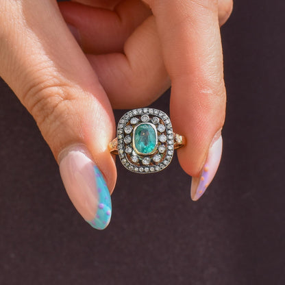 Emerald and Diamond Oval Cluster Halo Yellow Gold and Silver Ring | Antique Style