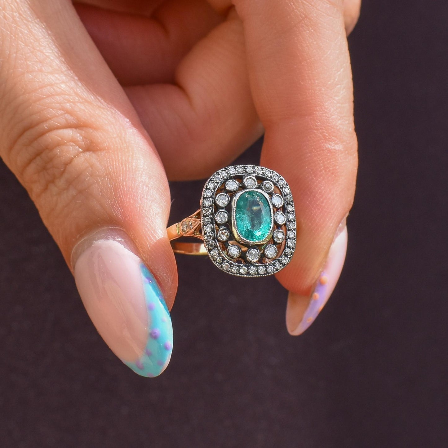 Emerald and Diamond Oval Cluster Halo Yellow Gold and Silver Ring | Antique Style
