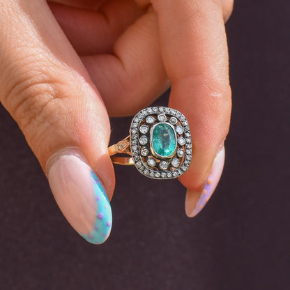 Emerald and Diamond Oval Cluster Halo Yellow Gold and Silver Ring | Antique Style