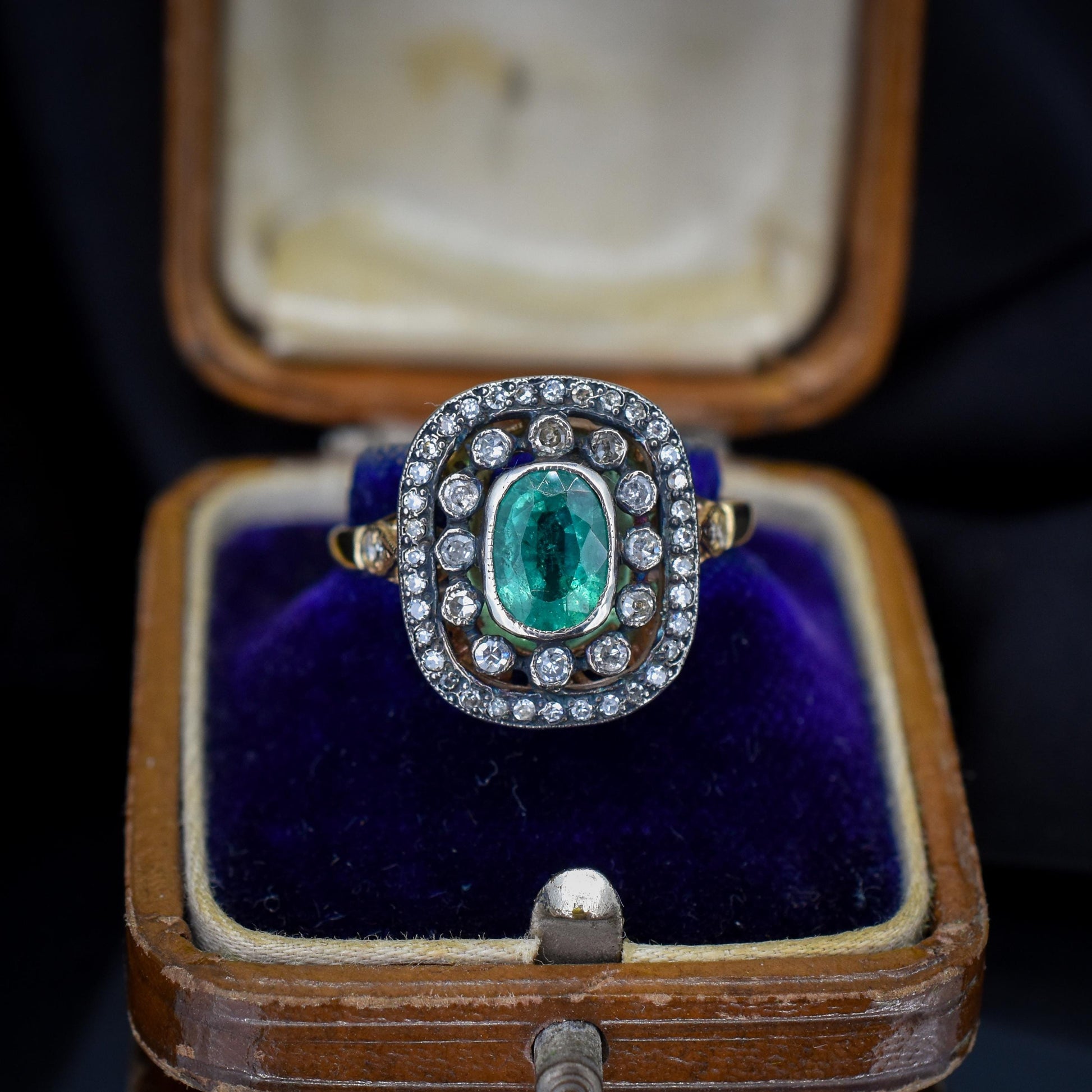 Emerald and Diamond Oval Cluster Halo Yellow Gold and Silver Ring | Antique Style