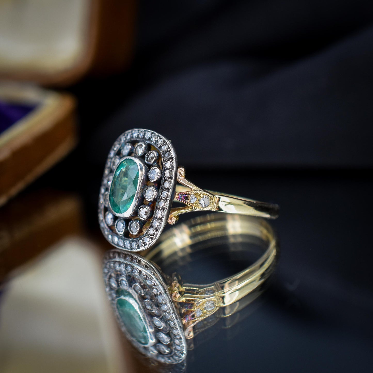 Emerald and Diamond Oval Cluster Halo Yellow Gold and Silver Ring | Antique Style