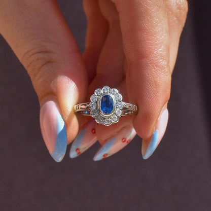 Blue Sapphire and Diamond Oval Cluster Halo 18ct White Gold Ring