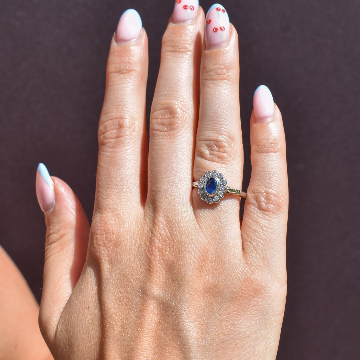 Blue Sapphire and Diamond Oval Cluster Halo 18ct White Gold Ring
