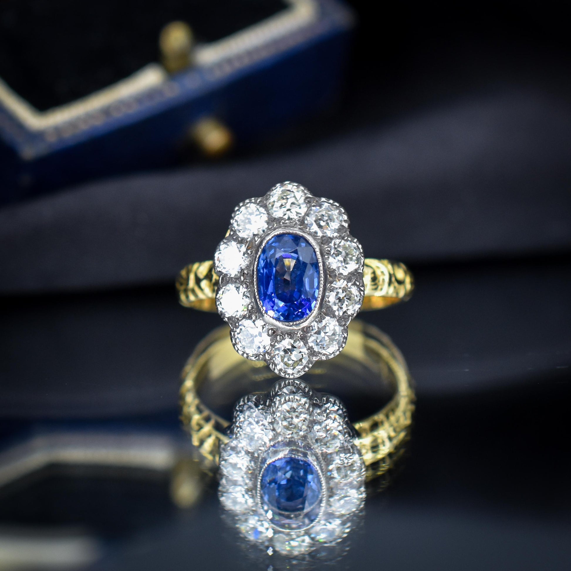 0.88ct Blue Sapphire and Diamond Oval Cluster 18ct Gold Ring