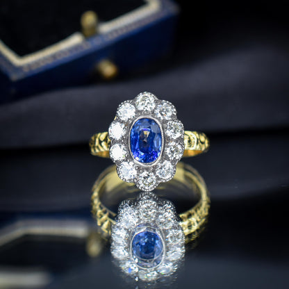 0.88ct Blue Sapphire and Diamond Oval Cluster 18ct Gold Ring