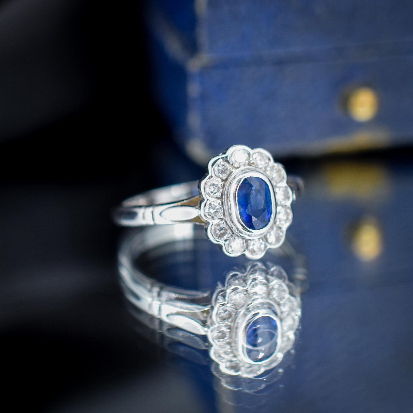 Blue Sapphire and Diamond Oval Cluster Halo 18ct White Gold Ring