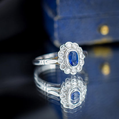 Blue Sapphire and Diamond Oval Cluster Halo 18ct White Gold Ring
