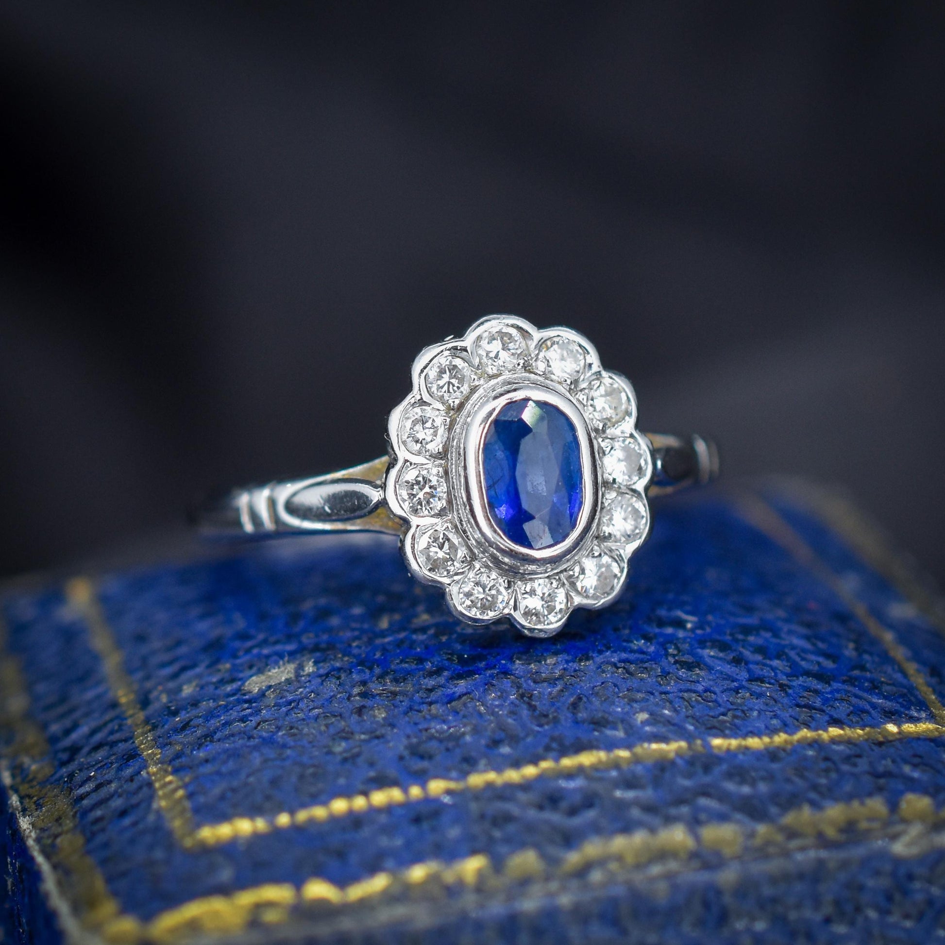 Blue Sapphire and Diamond Oval Cluster Halo 18ct White Gold Ring