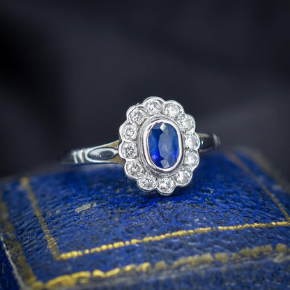Blue Sapphire and Diamond Oval Cluster Halo 18ct White Gold Ring