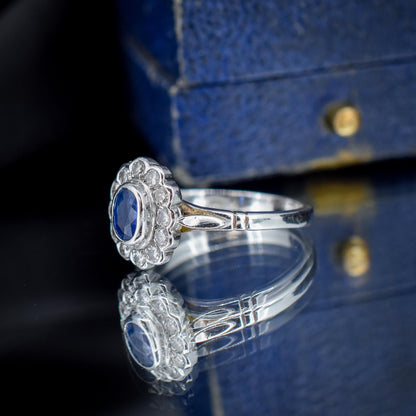 Blue Sapphire and Diamond Oval Cluster Halo 18ct White Gold Ring
