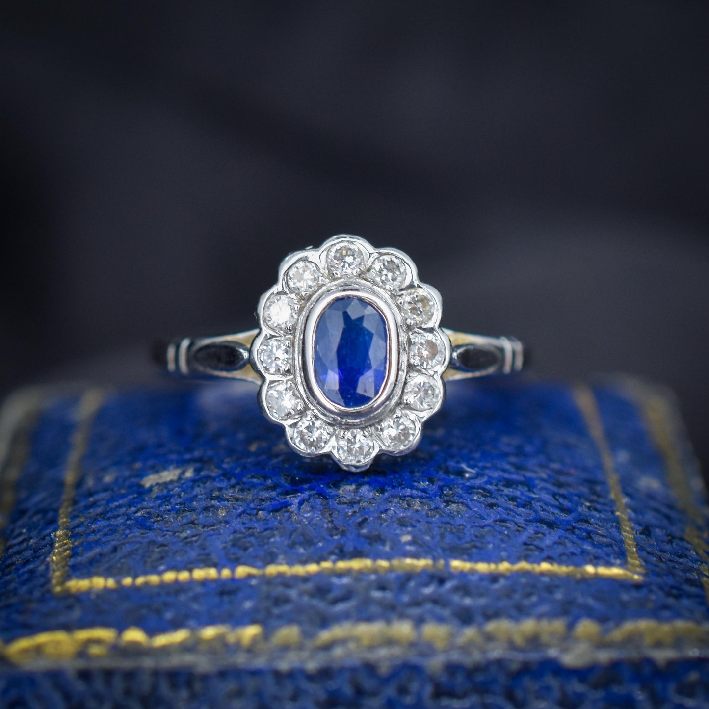 Blue Sapphire and Diamond Oval Cluster Halo 18ct White Gold Ring