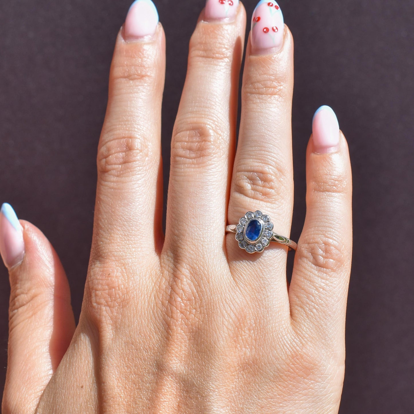 Blue Sapphire and Diamond Oval Cluster Halo 18ct White Gold Ring