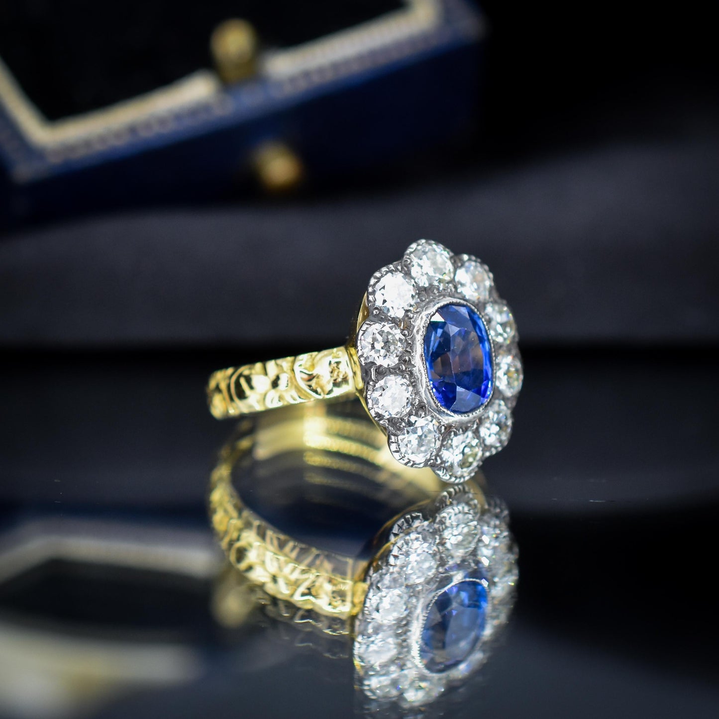 0.88ct Blue Sapphire and Diamond Oval Cluster 18ct Gold Ring