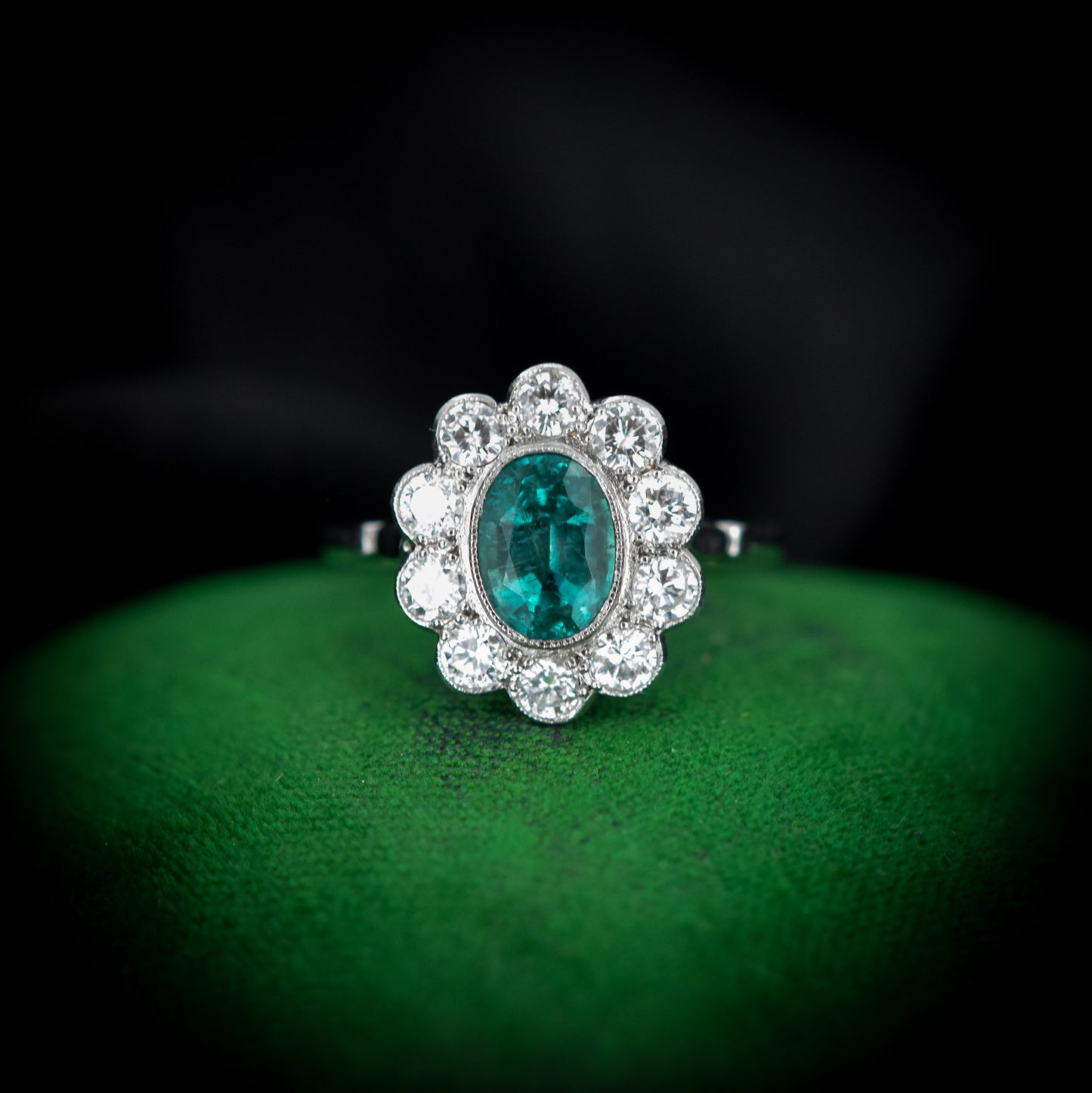 Emerald and Diamond Oval Cluster Halo Platinum Ring | Antique Style