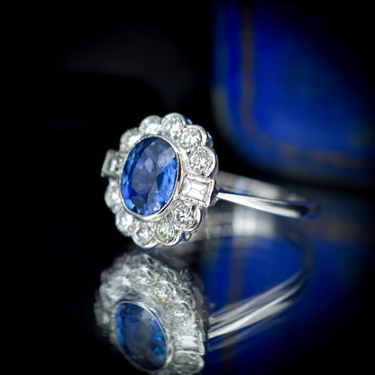 Oval Blue Sapphire and Diamond Bezel Halo Cluster Platinum Ring | Engagement